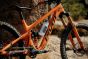 Fidlock-Twist-600ml-white-bottle-attached-to-an-orange-and-black-bike