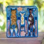 SodaPup-Waiting-Dogs-Design-Etray-Blue-Outlines-of-three-dogs-full-of-food-and-stood-up-against-a-blurred-nature-background